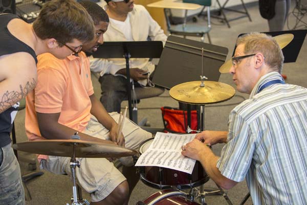Professor Denison works on techniques with percussionists.