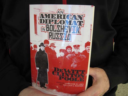 Hands holding the book An American Diplomat in Bolshevik Russia