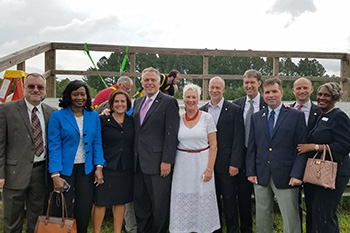 group photo of Governor McAuliffe with representatives from TCC and local government