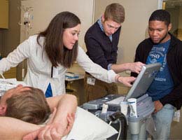 TCC student Elyse Taylor mentors a pair of EVMS medical students in using ultrasound.