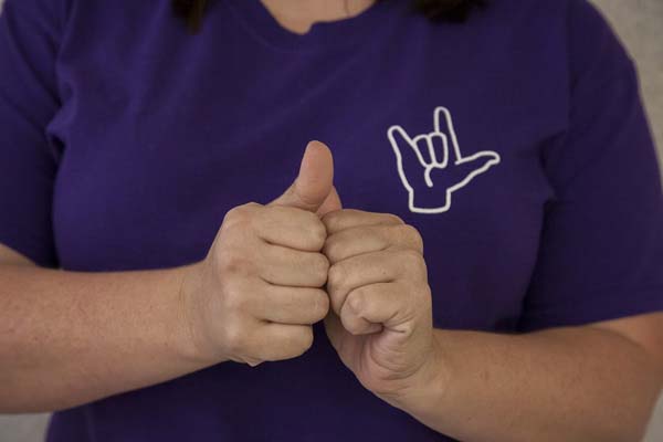 American Sign Language includes hand shapes, movements and facial expressions.