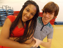 Two ballroom dancing students at TCC smile and have fun.