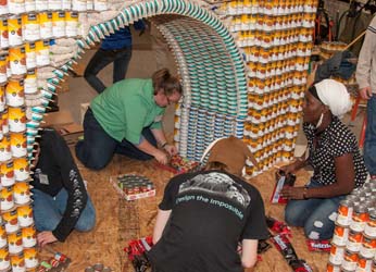 Engineering Club students work on a bridge design made out of cans