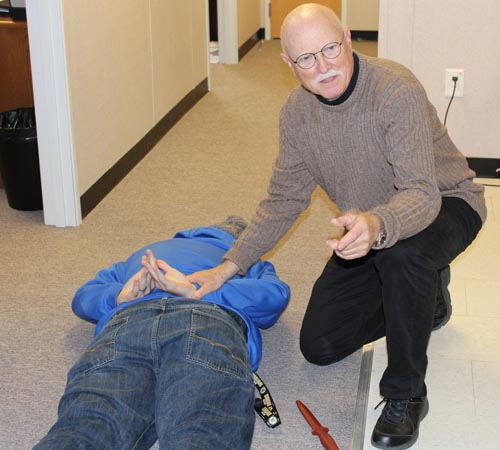 Bill Pearsall, program head at the Chesapeake Campus, works with students during a scenario.