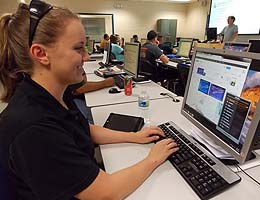 Online student Beth Quesada joins a face-to-face class lecture.