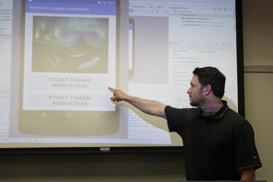 Professor Jared Oliverio demonstrating frame animations on a mobile application