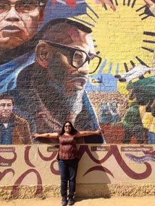 Sandra Itliong-Bowman in front of her father's mural in Filipinotown, Los Angeles