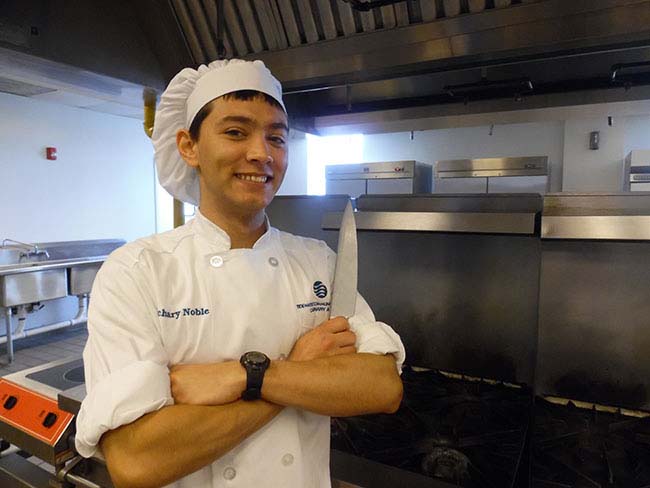 TCC Culinary Arts student Zachary Noble getting hands-on kitchen experience