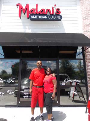 John and Janine Williams in front of Malani's American Cuisine